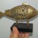 Bronze fish on pedestal India