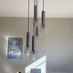 Large suspension chandelier with 5 glass lampshades and aluminium tube.