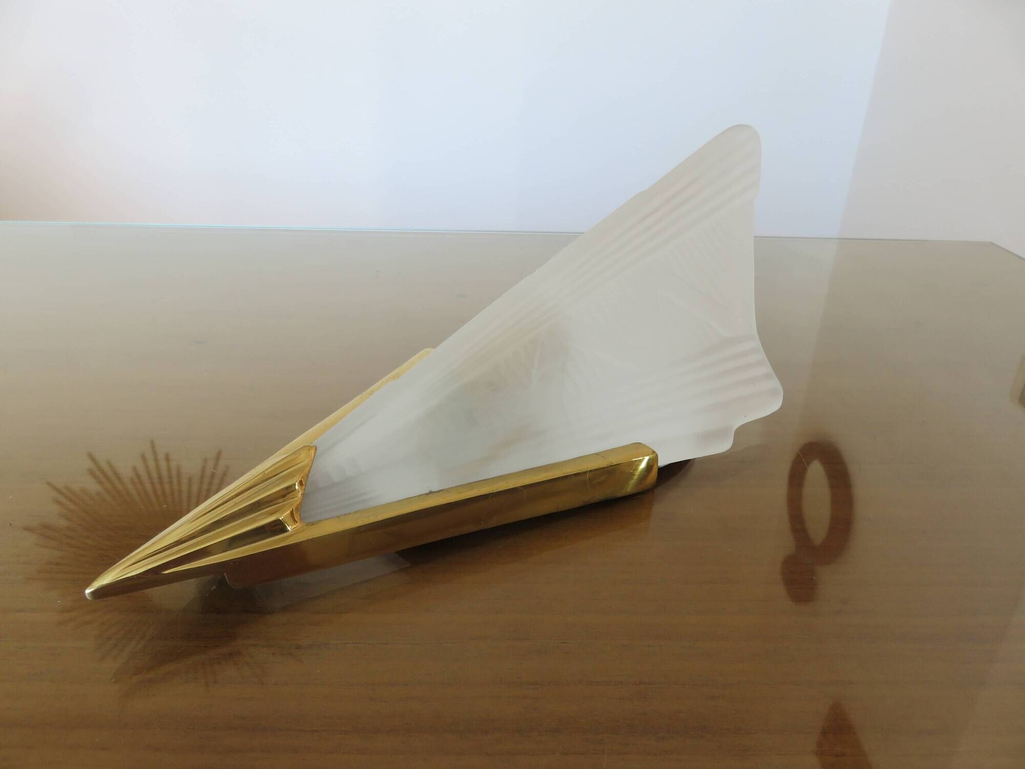 Art Deco wall light in brass and thick frosted glass.