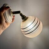 Vintage globe wall light in frosted pink and gold glass.