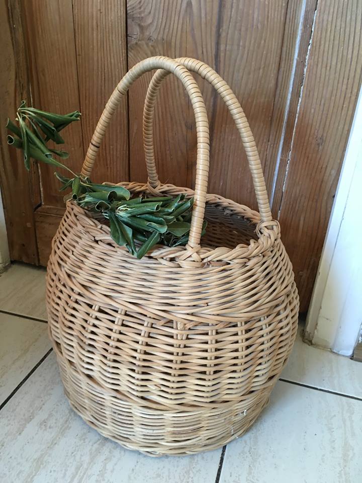 Round basket Wicker braided with two handles.