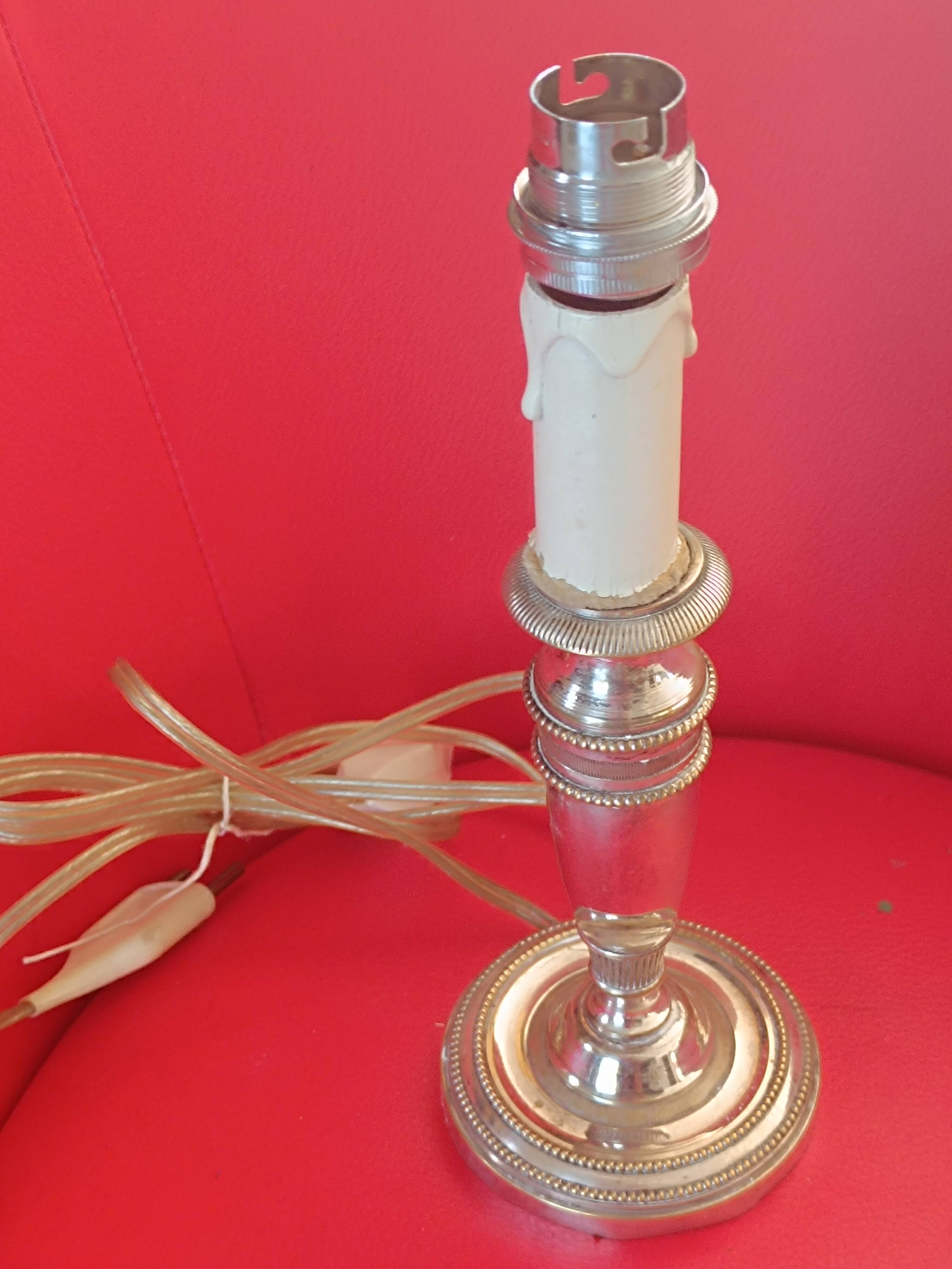 Old lamp base in silver metal.