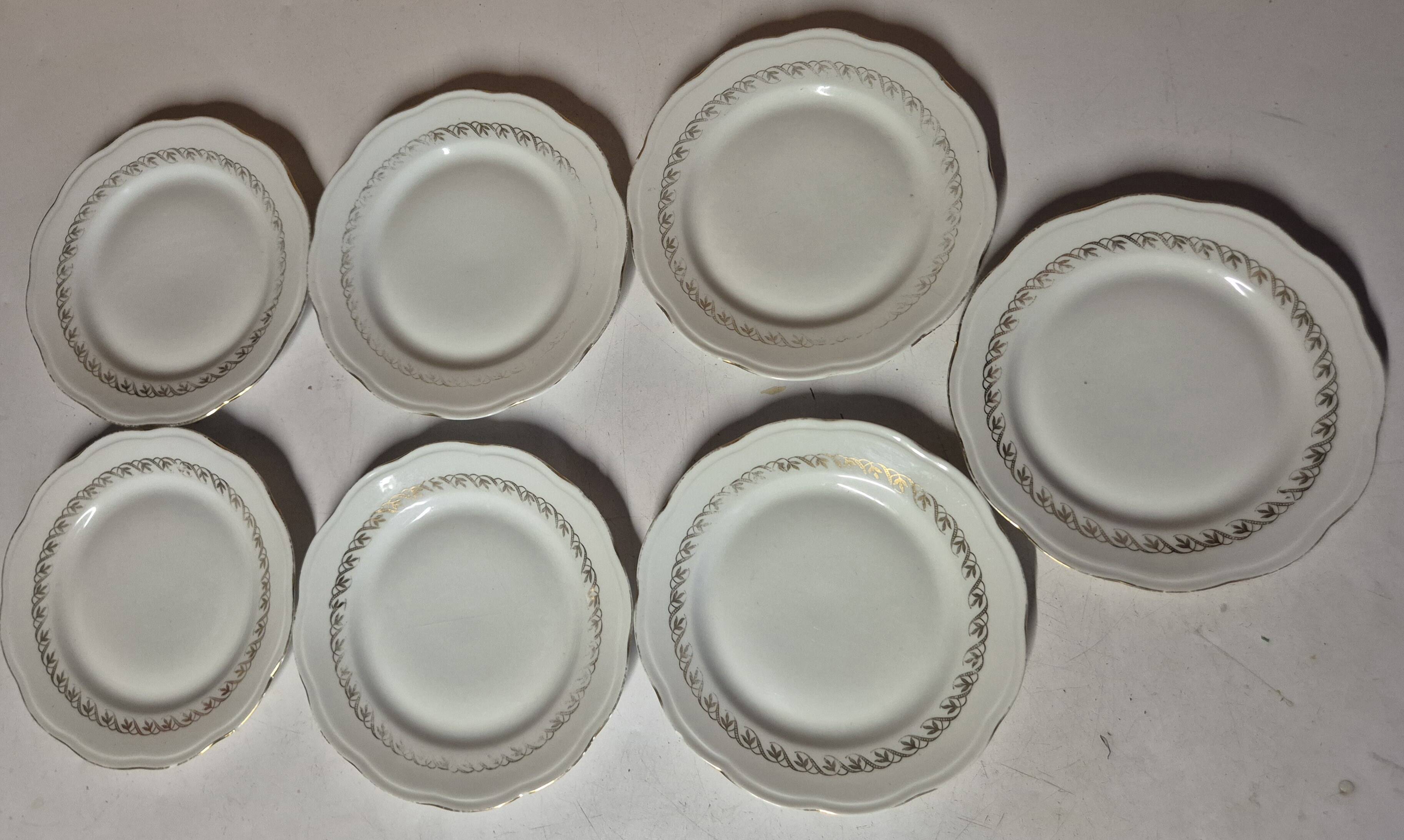 Set of 7 fine porcelain dessert plates with gilding, SFP, French company