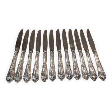 12 silver-plated dessert knives by St Medard, rocaille style, Florian.