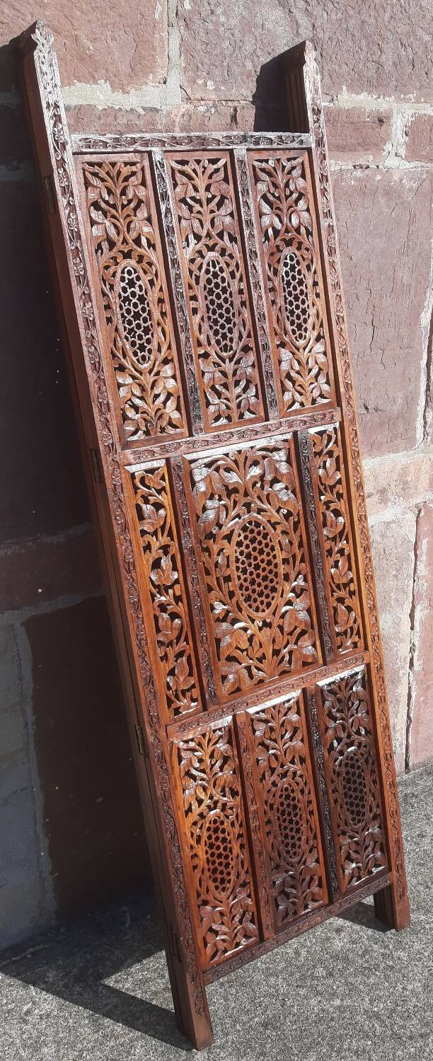 Carved solid wood screen.