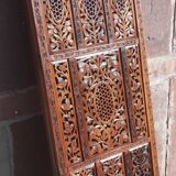 Carved solid wood screen.