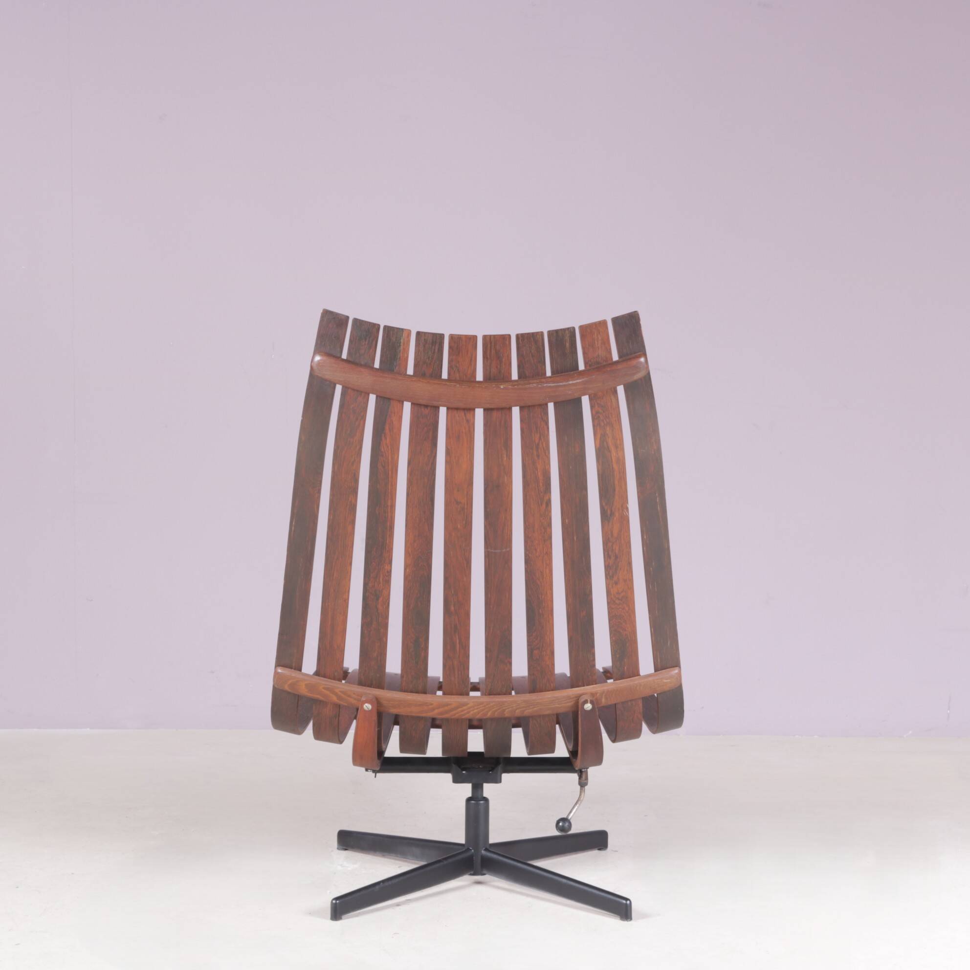 Lounge chair Rosewood with black metal cross base Hans Brattrud 1960s