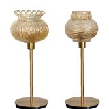 Table lamp with a textured antique globe and a golden base