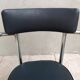 Vintage office chair in chrome metal and faux leather.