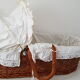 Old rattan bassinet and bedding