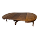 Round walnut table in solid wood, Napoleon III style with extensions - for 14 settings.