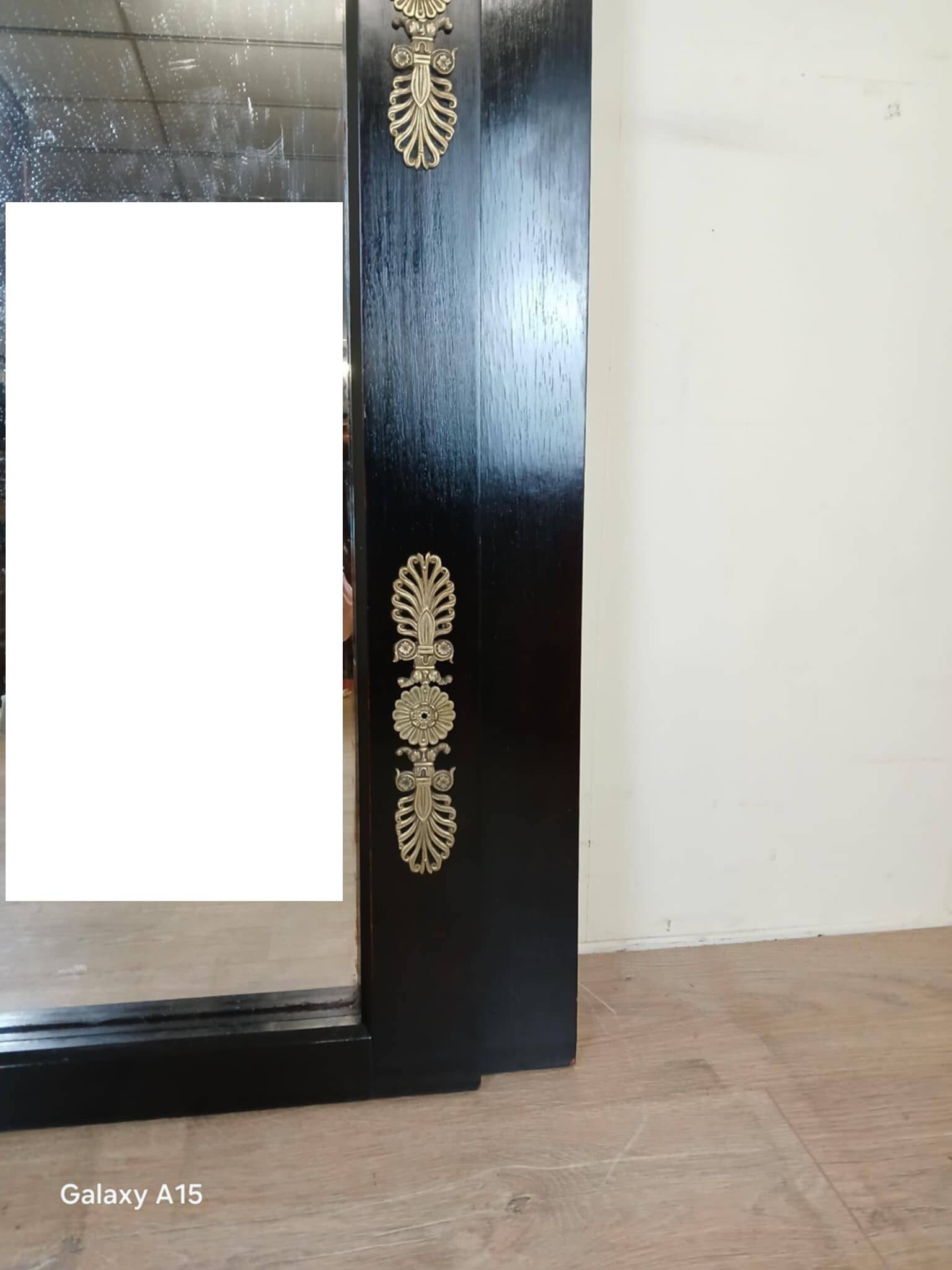 Miroir Empire en bois laqué noir et bronze doré époque XIXeme