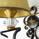1950 gold star and black metal sconces