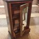 Antique doll cabinet