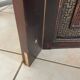 Antique wooden wall panel with carving and cane in an Asian style.