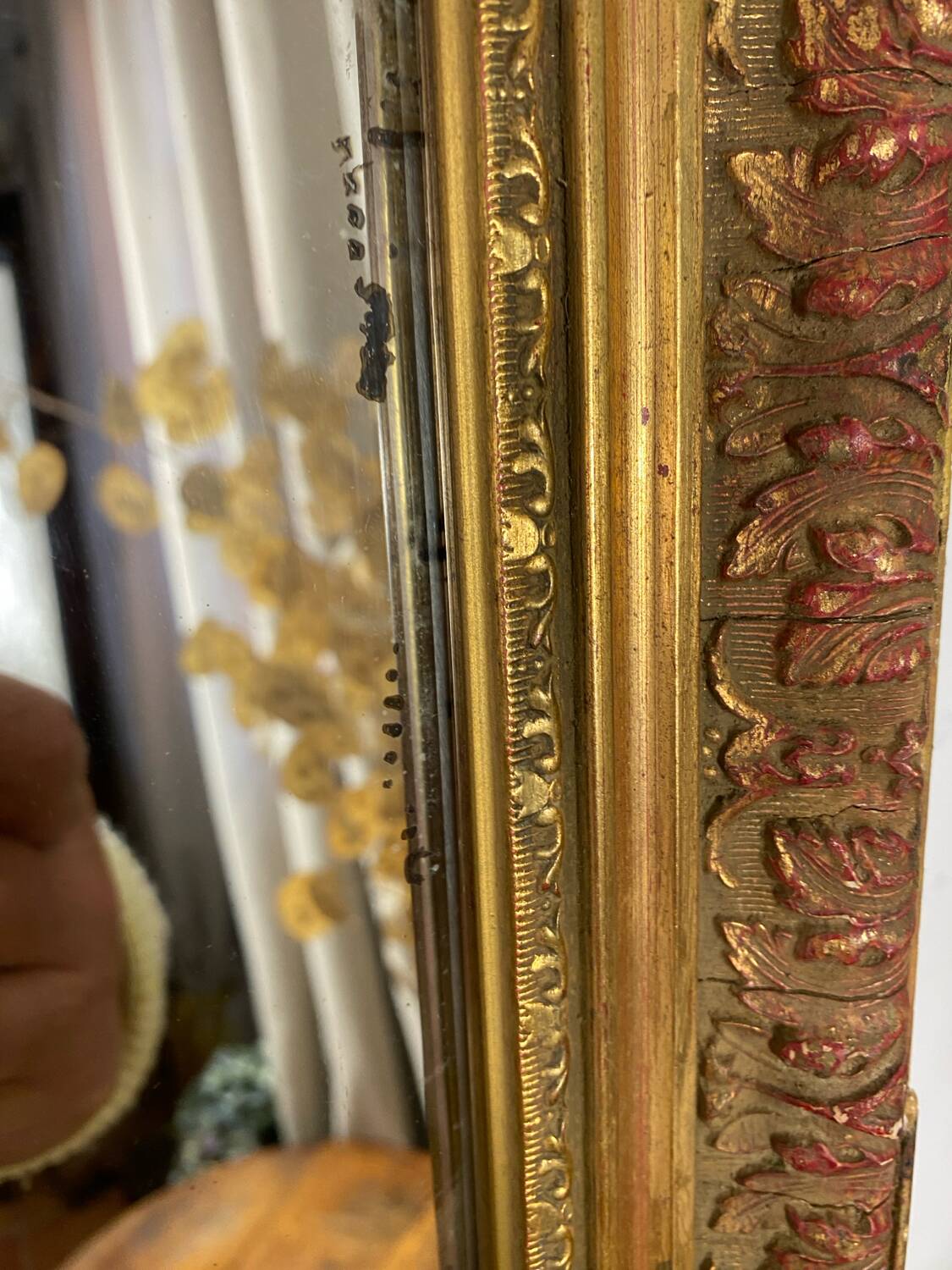 Antique mirror in carved gilded wood