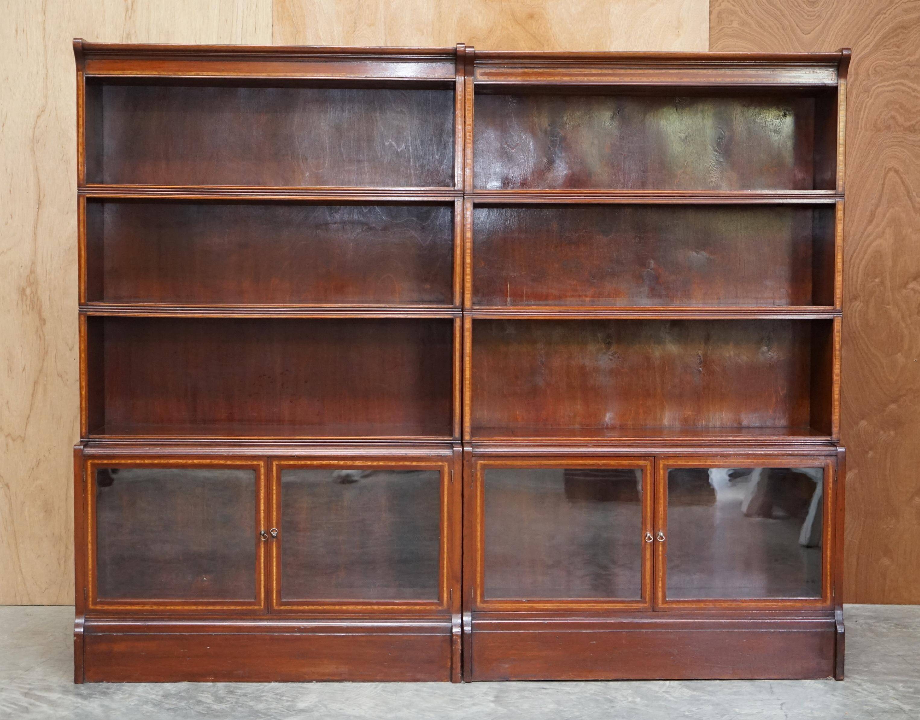 Antique pair of legal bookcases by William Baker Co in hardwood, satin and walnut.
