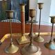 Set 7 mismatched brass and bronze candlesticks