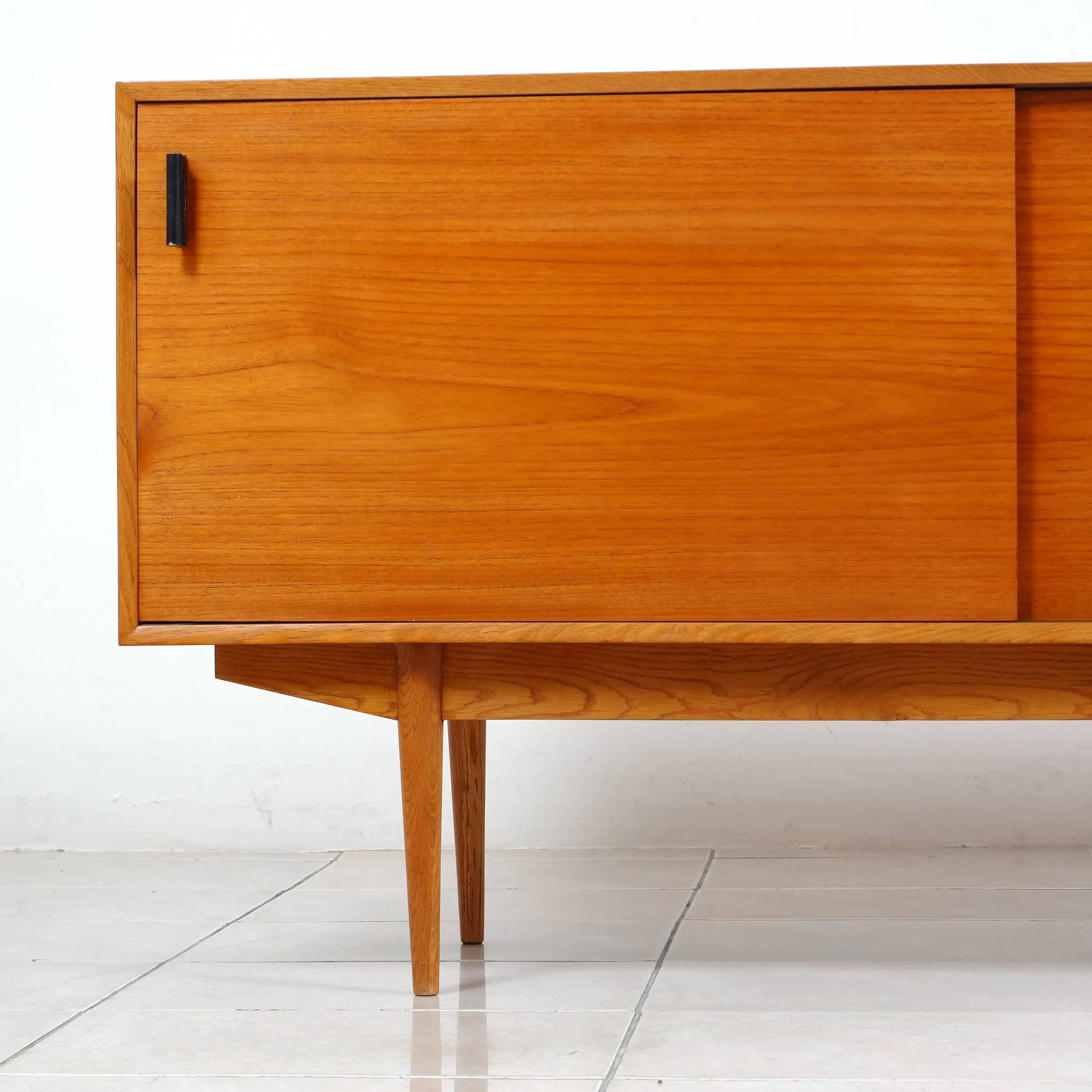 Swedish teak sideboard with leather handles