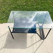 Metal and glass coffee table with magazine rack by Roche Bobois from the 1950s.