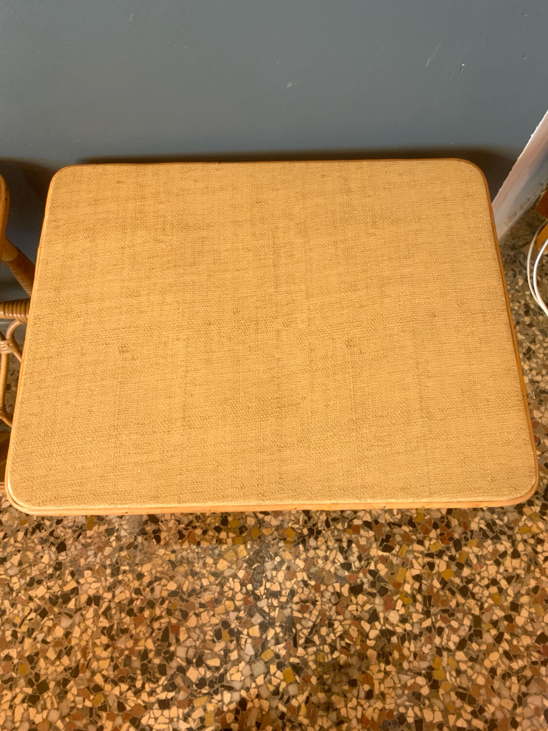 A pair of rattan bedside tables.