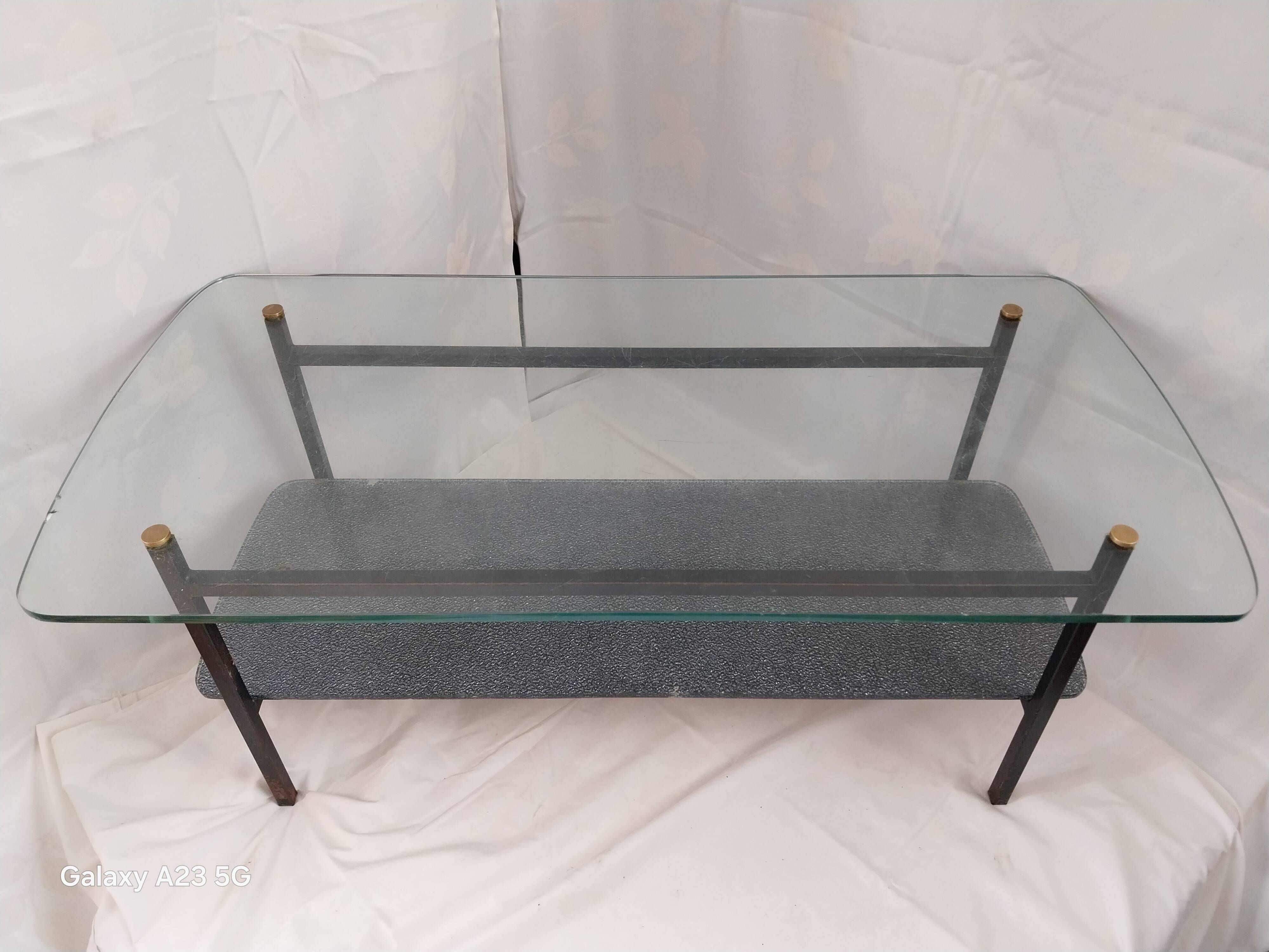Modernist coffee table with double glass top and black metal - 1950s.