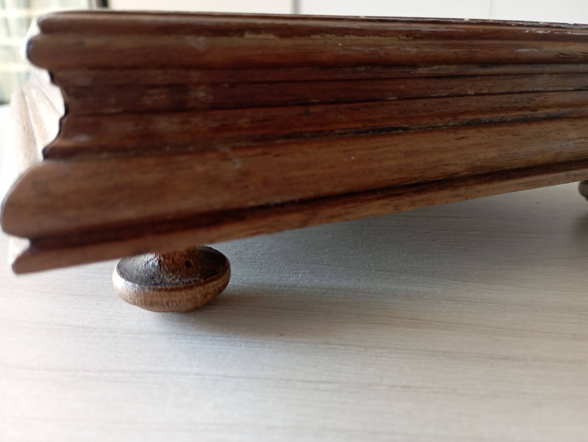 Old wood and ceramic trivet