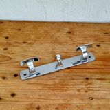 Vintage chrome wall coat rack with three hooks.