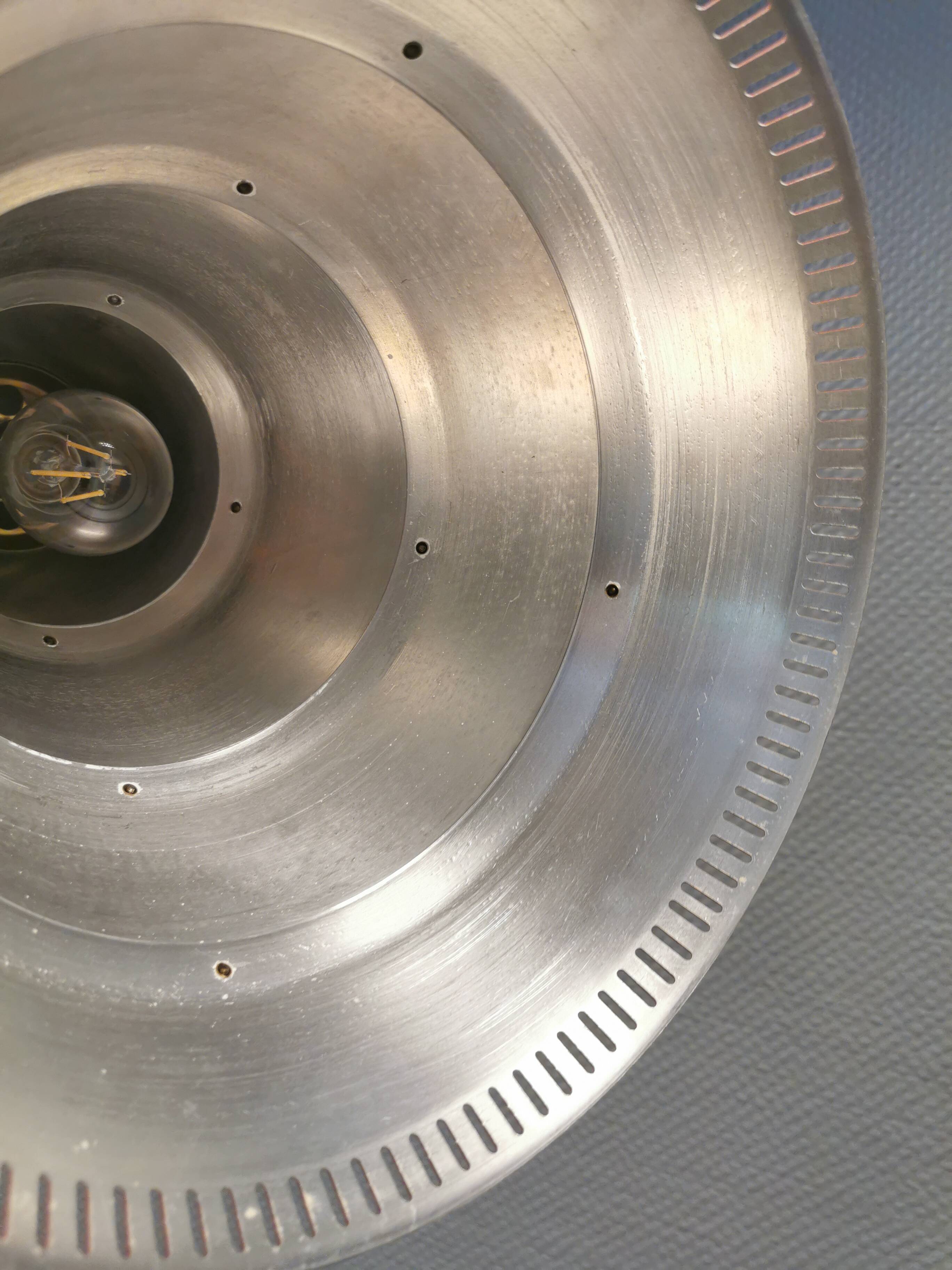 Knud Hjerting Metal layered cone-shaped hanging lamp with perforated detail on the edge. Model P208