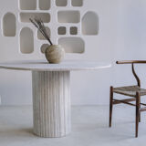 Omega circular dining table in natural travertine
