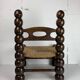 Chaise basse en bois tourné dans le style de Charles Dudouyt, France, années 1950