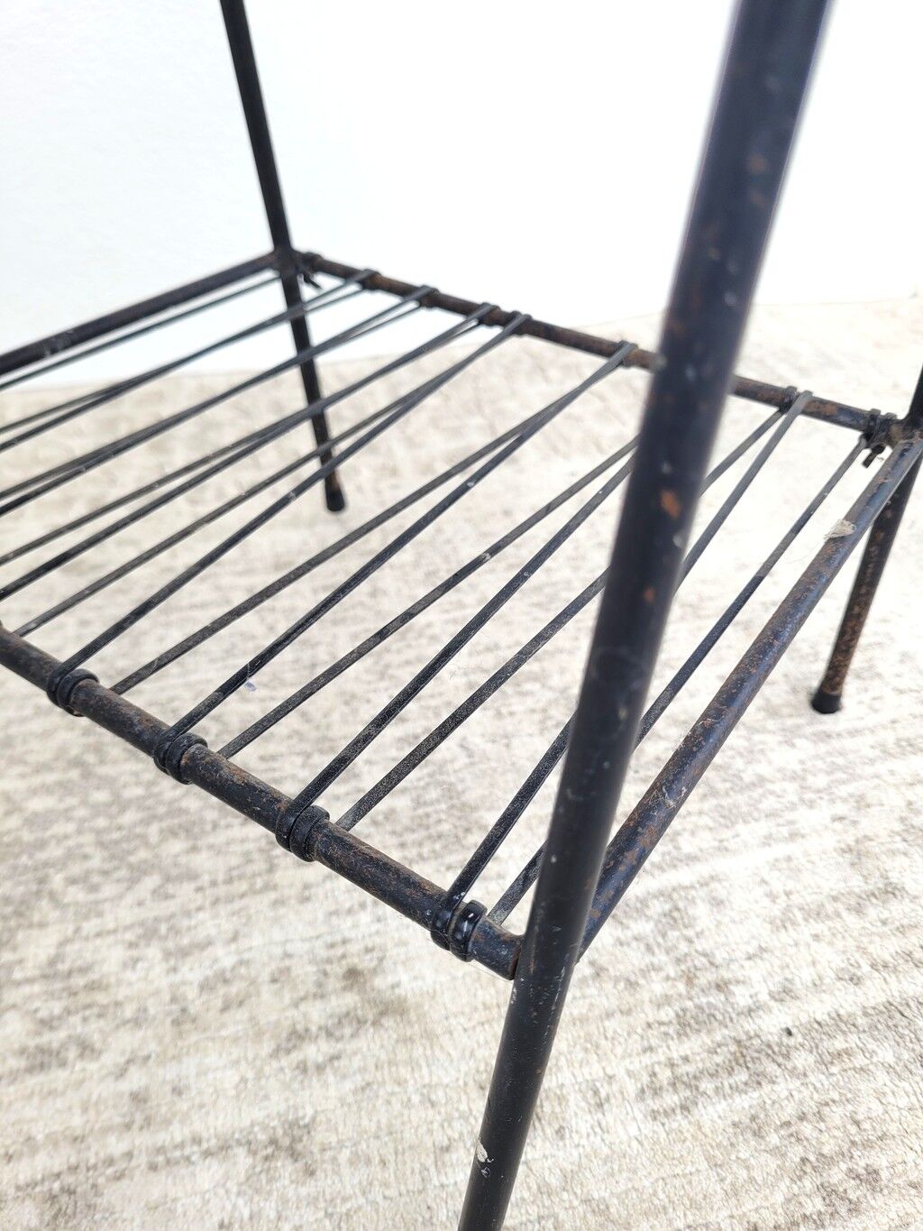 Small vintage yellow side table with magazine rack.
