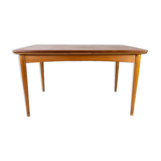 Dining table in teak with extentions and legs in oak, of danish design from the 1960s.