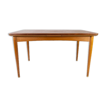 Dining table in teak with extentions and legs in oak, of danish design from the 1960s.