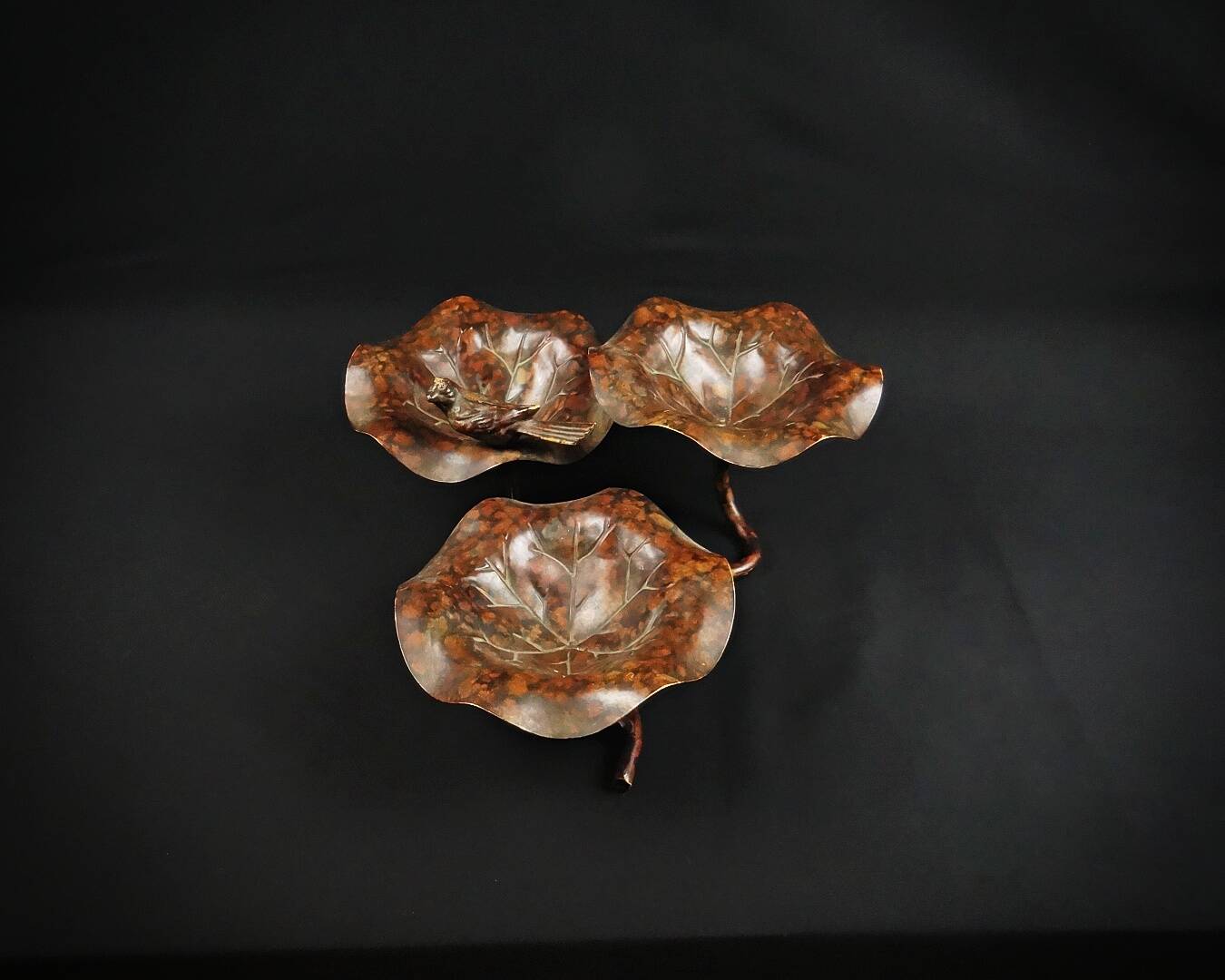 Three-tiered lotus leaf shaped patinated metal bird bath