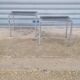 Pair of side tables in chrome metal and glass
