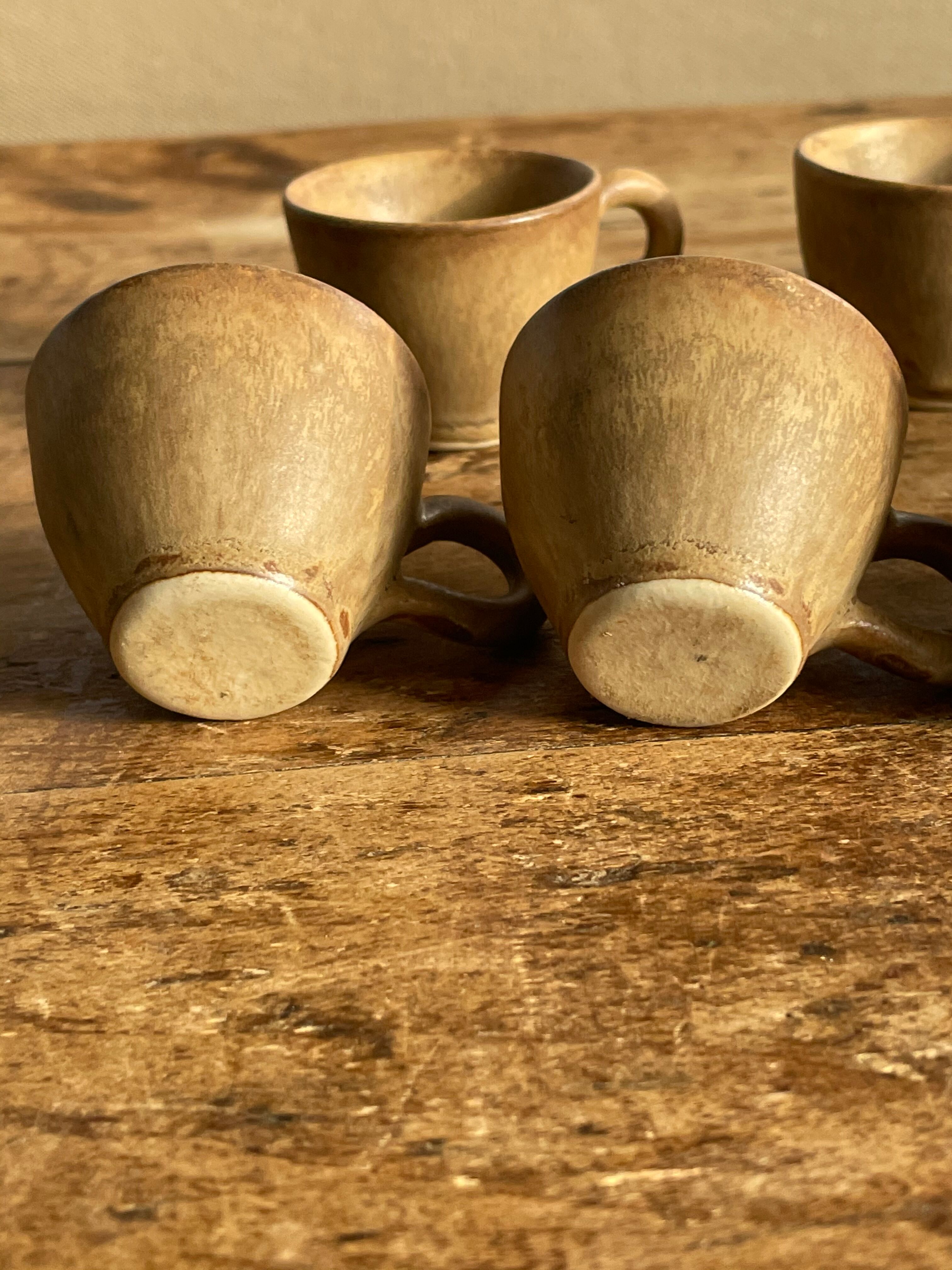 7 very small old sandstone coffee cups