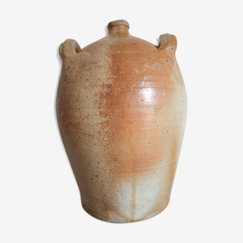 Ancient jar in varnished sandstone