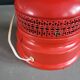 Vintage globe lamp with a metal base, perforated and lacquered in red.