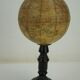 Globe on turned and blackened wooden base