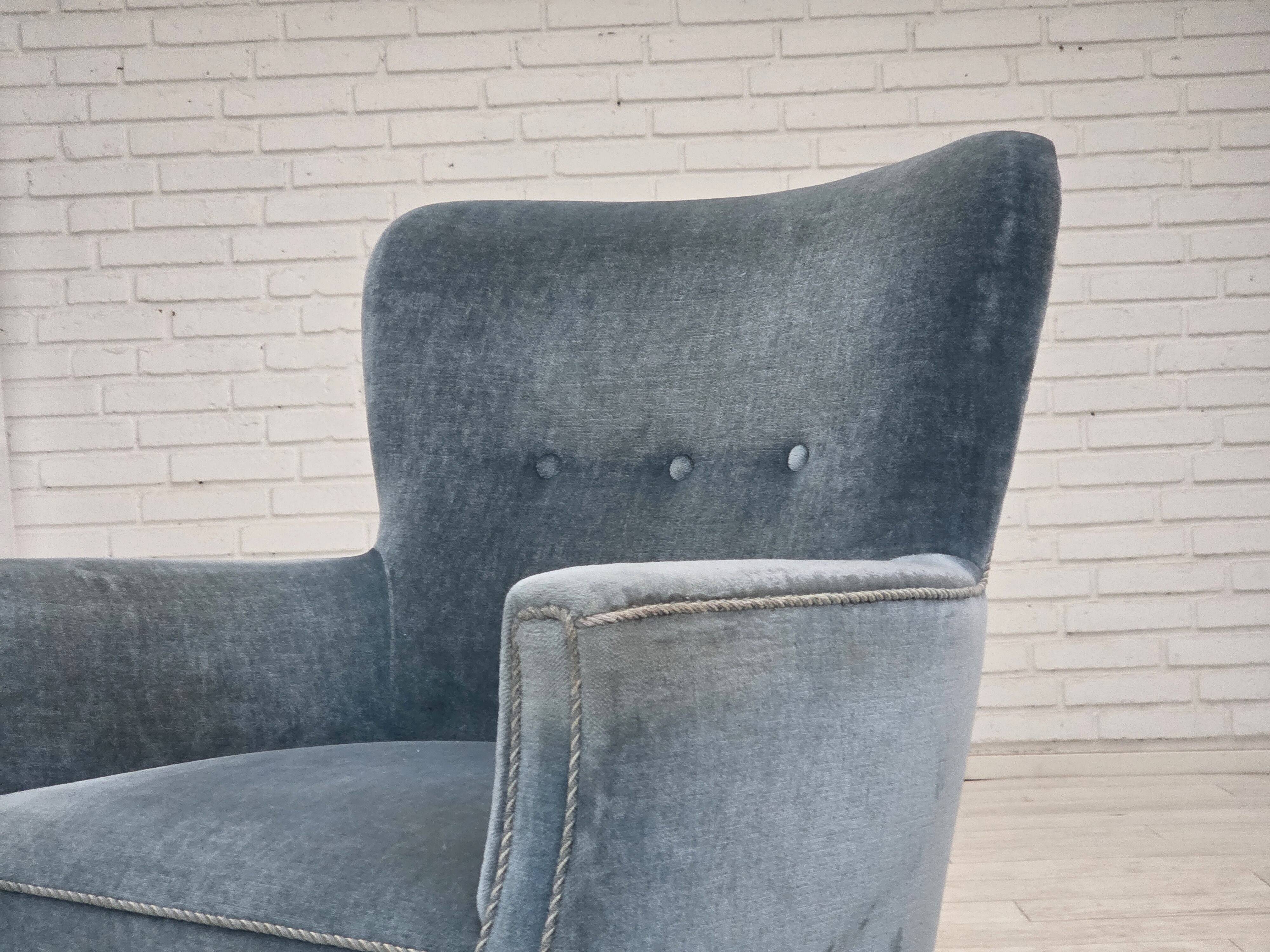 1970s, Danish armchair with footstool, blue furniture velour, oak wood legs