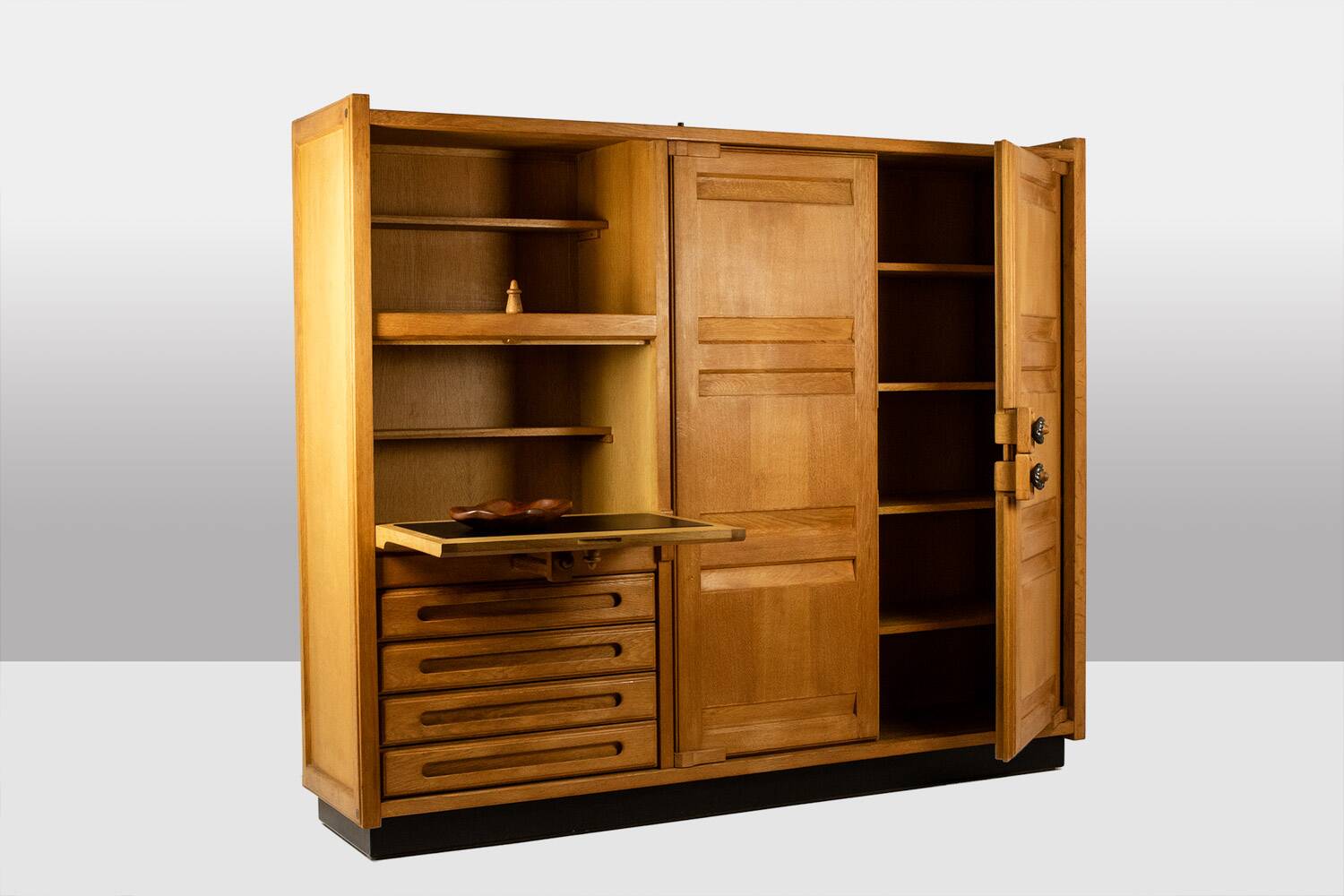Guillerme and Chambron. Oak wardrobe with integrated secretary. 1970-80.
