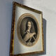 Classic antique man portrait in gilded frame