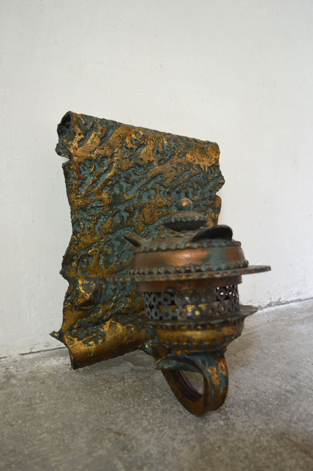 Pair of patinated wrought iron sconces