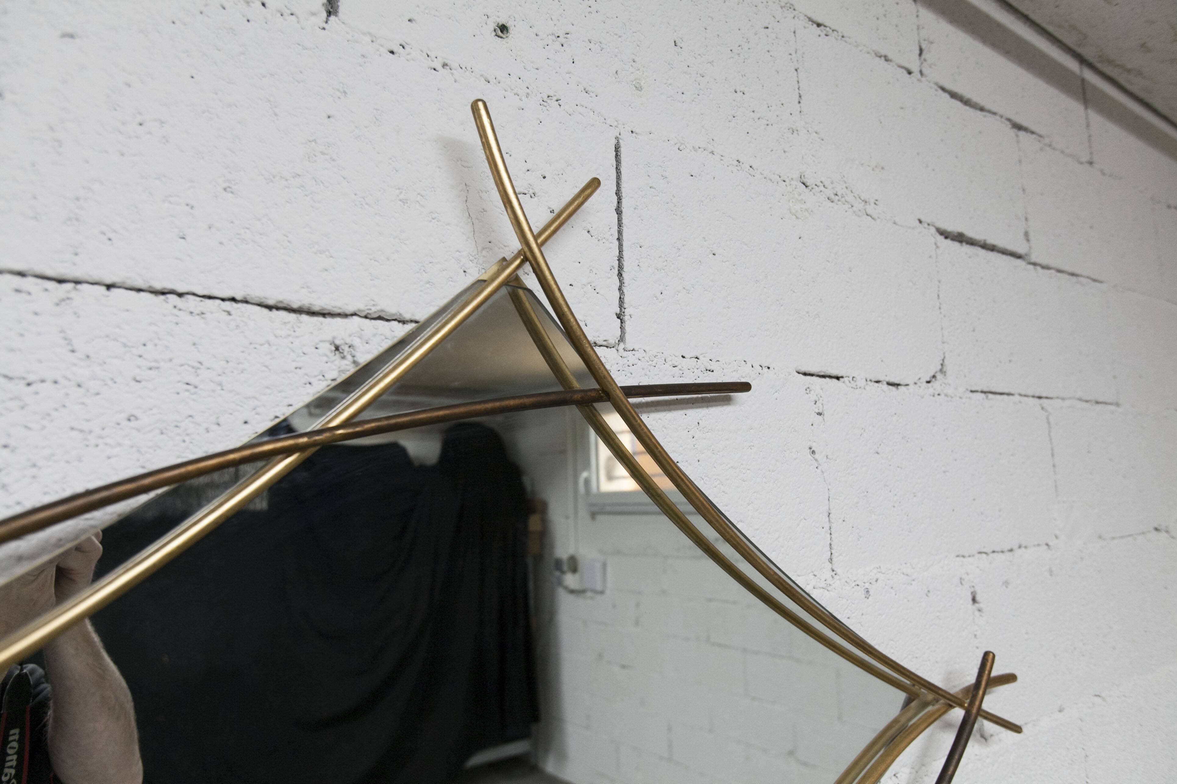 Sculptural mirror with two-tone gilded arches, France, 1970s, 95 x 133 cm