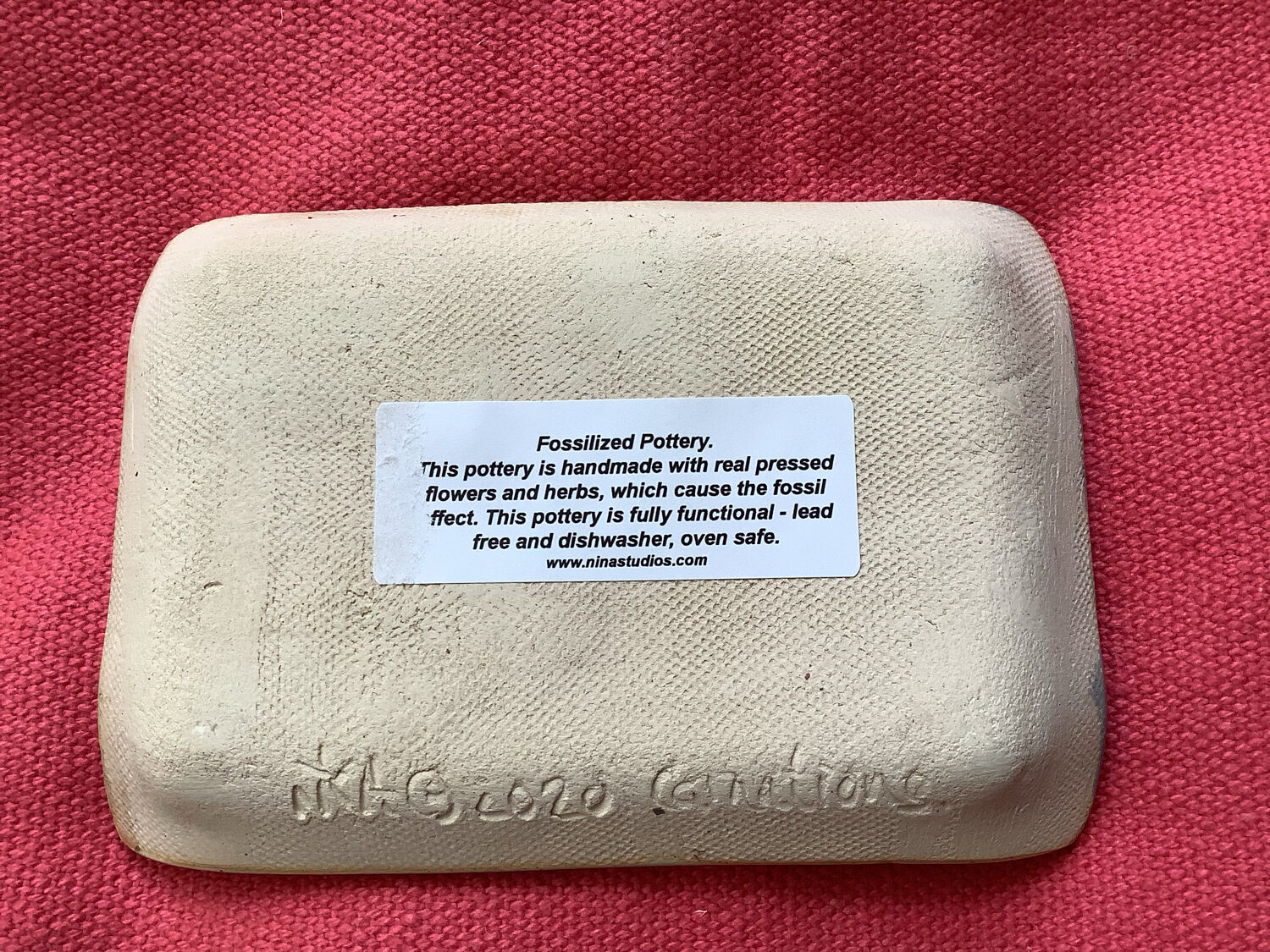 Arty enameled terracotta dish signed by the artist