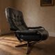 Scandinavian swivel lounge chair in black leather with a bent wood frame, 1970s.