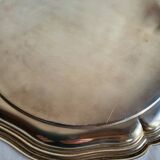 Round silver-plated serving dish with a glass base.