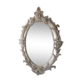 Antique oval mirror carved in wood.