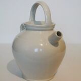 Old jug chevrette gargoulette in varnished white sandstone